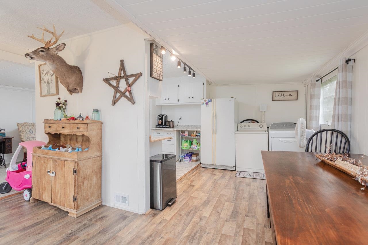 411 4th Street Luray, VA 22835 - Photo 6 of 34 a view of a kitchen with furniture and wooden floor