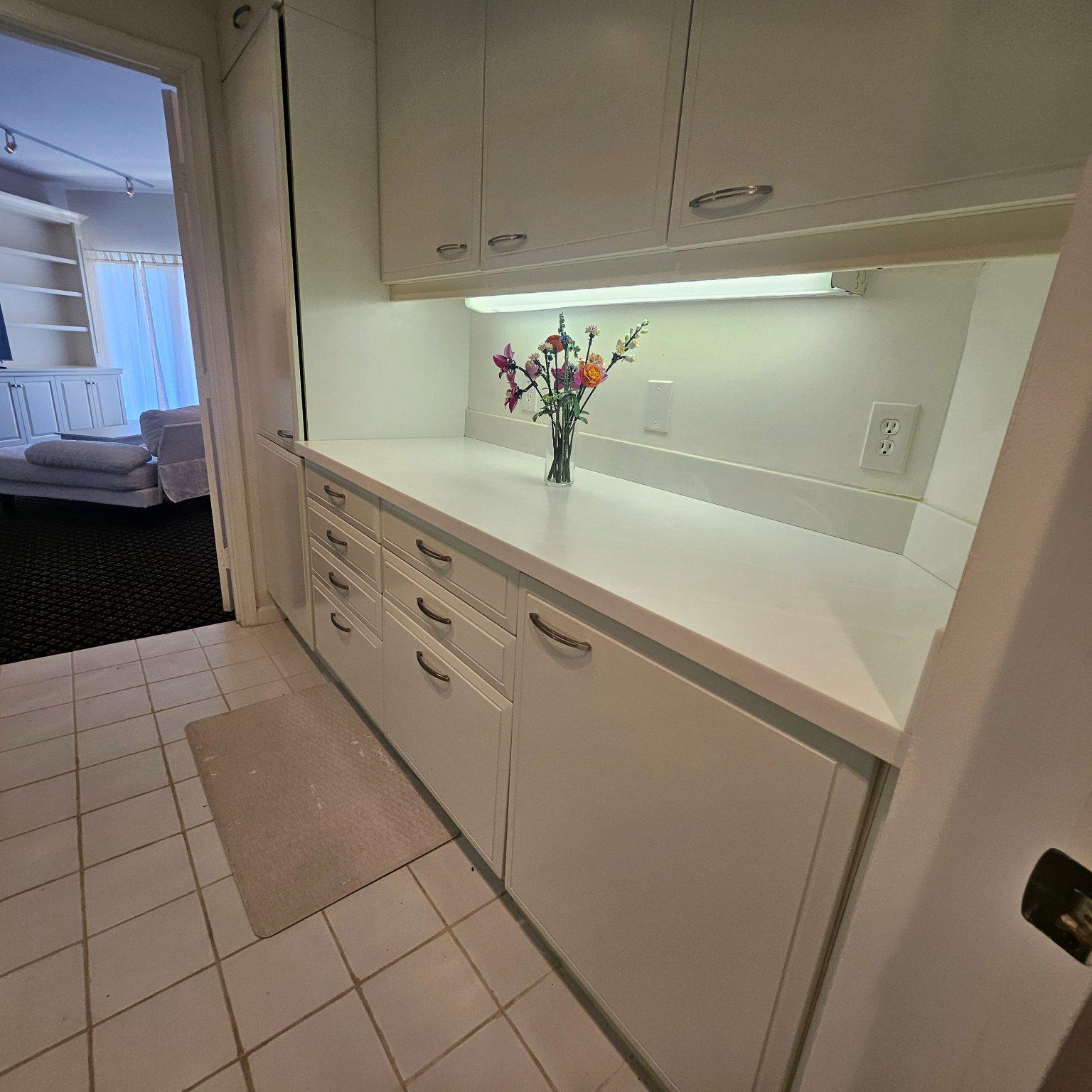 3801 Canterbury Road, Unit 611 Baltimore, MD 21218 - Photo 14 of 32 a kitchen with cabinets and a stove