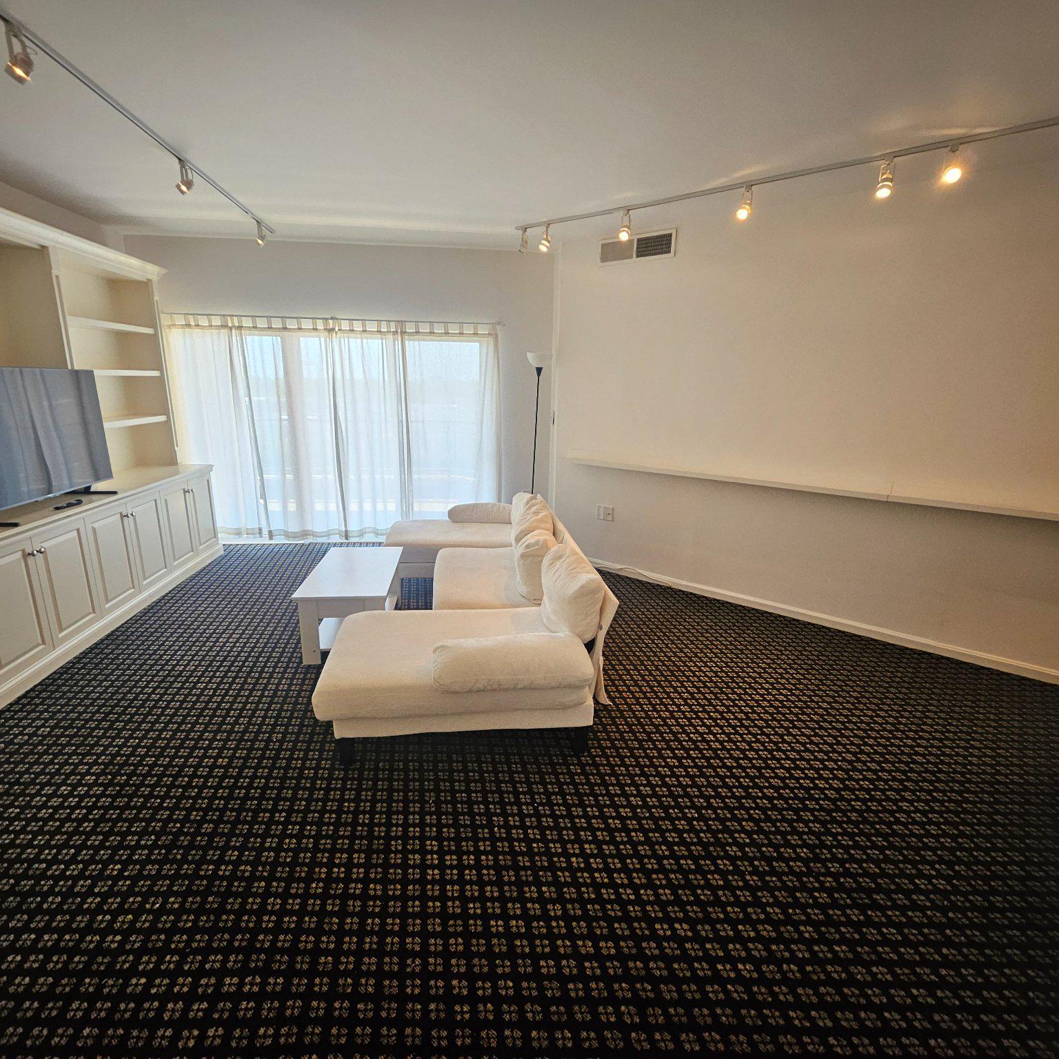 3801 Canterbury Road, Unit 611 Baltimore, MD 21218 - Photo 2 of 32 a living room with a black white checkered floor