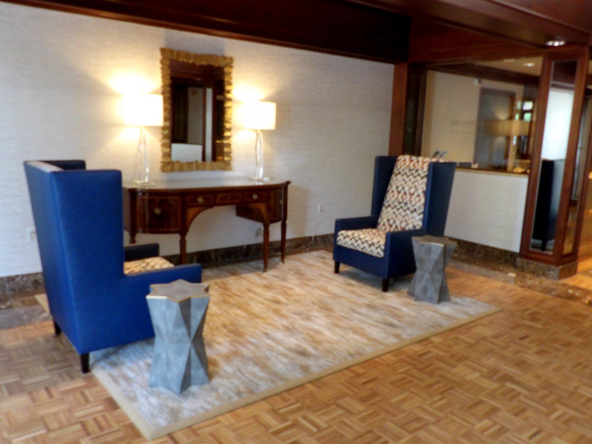 3801 Canterbury Road, Unit 611 Baltimore, MD 21218 - Photo 26 of 32 a living room with furniture and a dining table