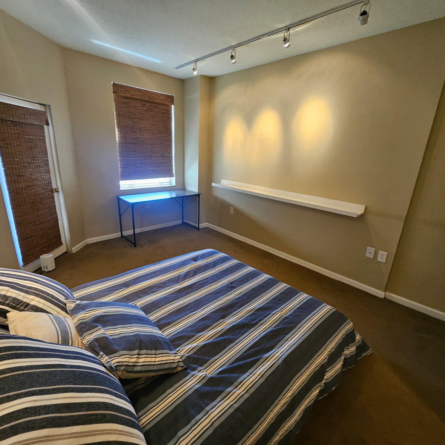 3801 Canterbury Road, Unit 611 Baltimore, MD 21218 - Photo 8 of 32 a bedroom with bed and a window