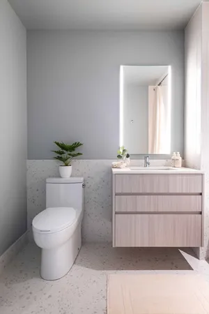 a bathroom with a tub sink and a mirror