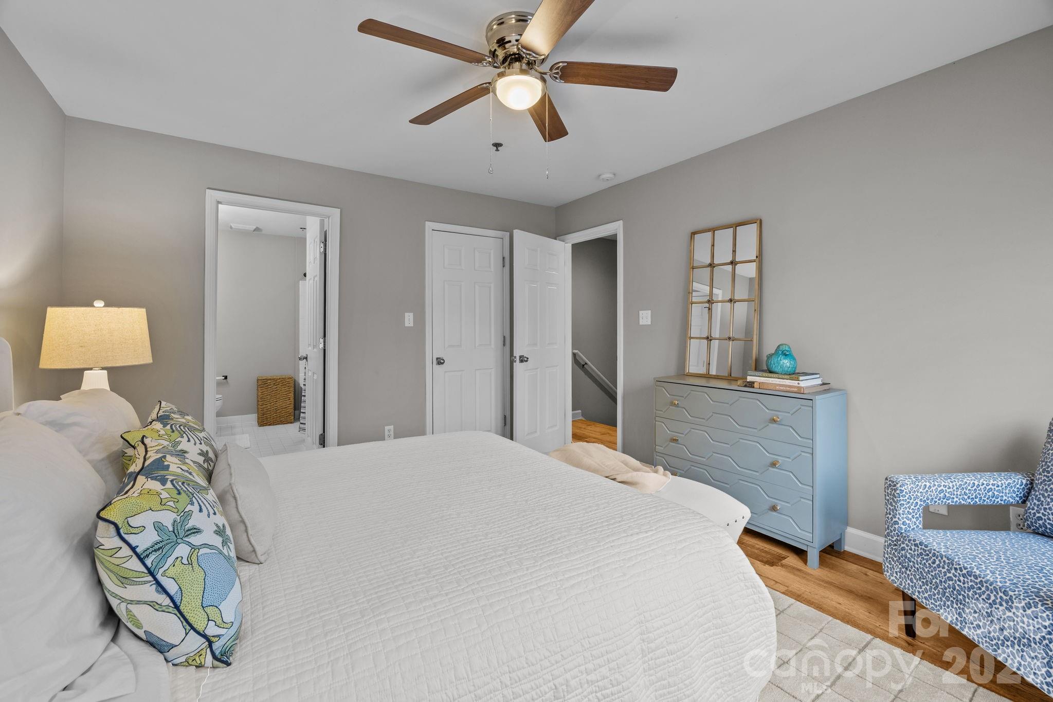 416 Queens Road, Unit 19 Charlotte, NC 28207 - Photo 12 of 24 a bedroom with a bed dresser and a window