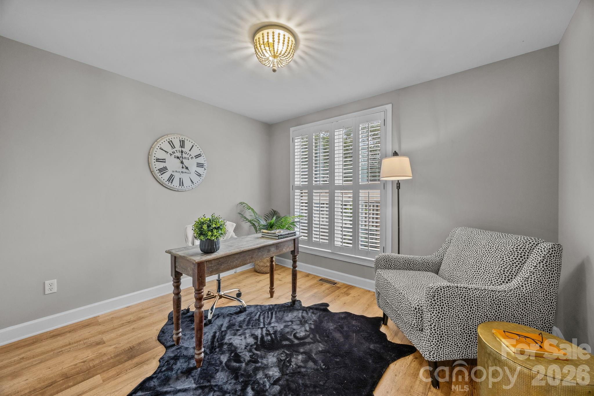 416 Queens Road, Unit 19 Charlotte, NC 28207 - Photo 15 of 24 a living room with furniture and a window