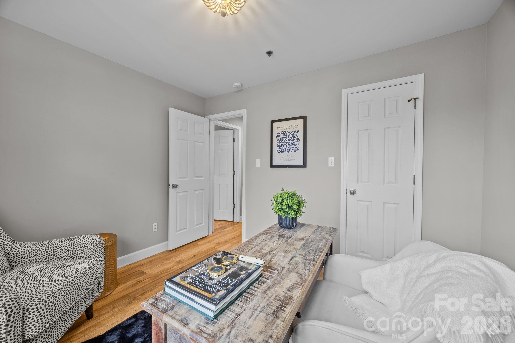416 Queens Road, Unit 19 Charlotte, NC 28207 - Photo 15 of 23 a bedroom with a bed and a couch