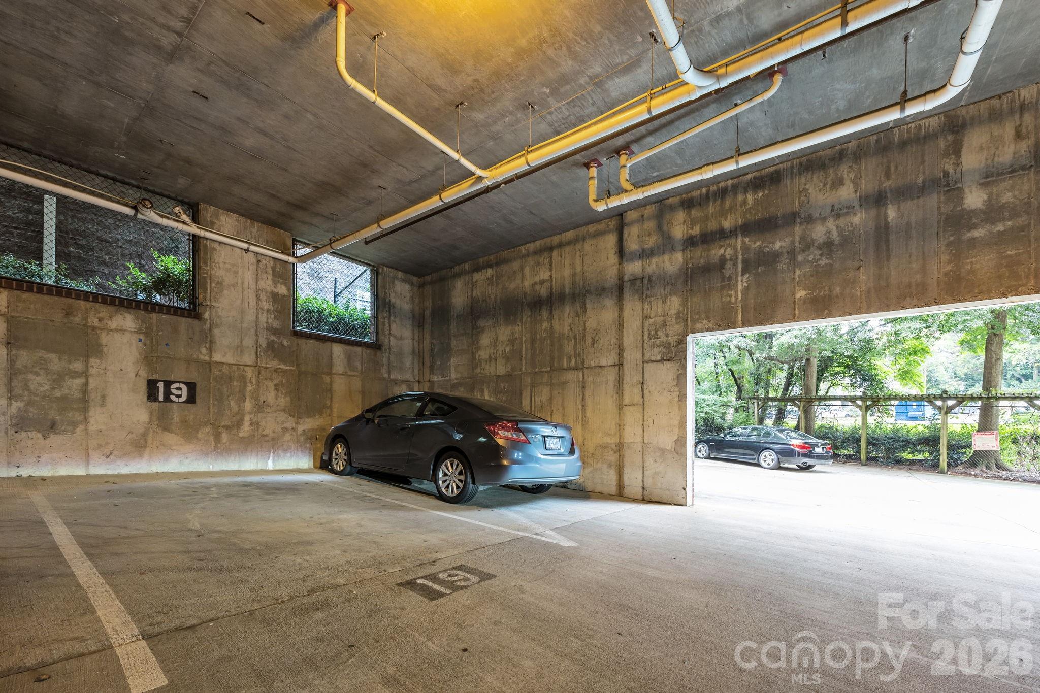 416 Queens Road, Unit 19 Charlotte, NC 28207 - Photo 19 of 24 a car parked in front of a building