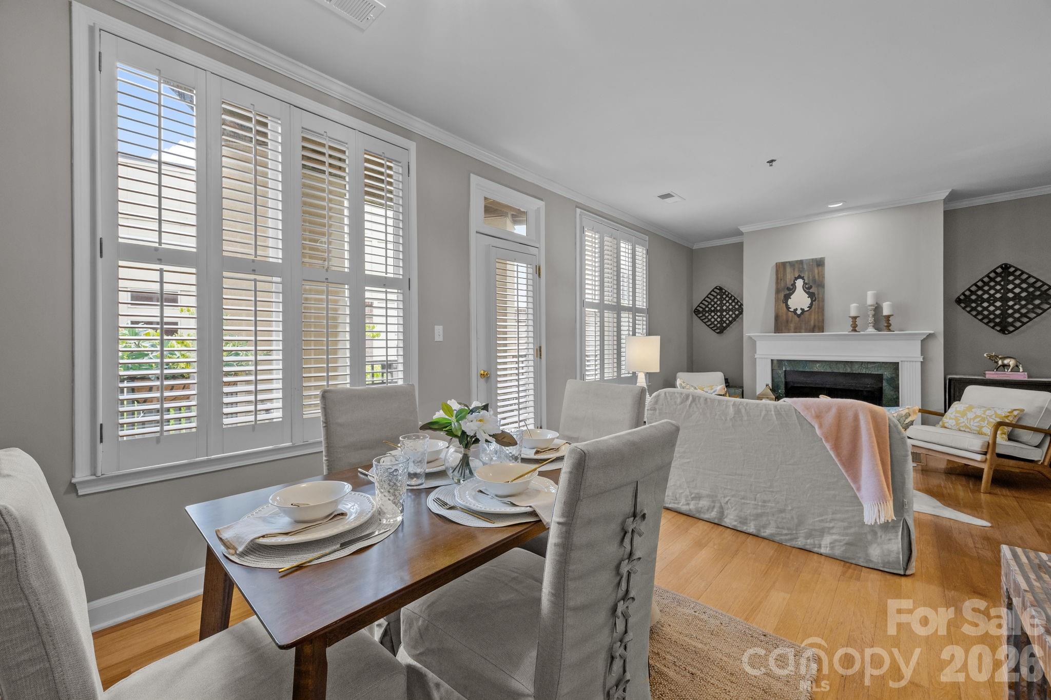 416 Queens Road, Unit 19 Charlotte, NC 28207 - Photo 3 of 24 a living room with furniture and a fireplace