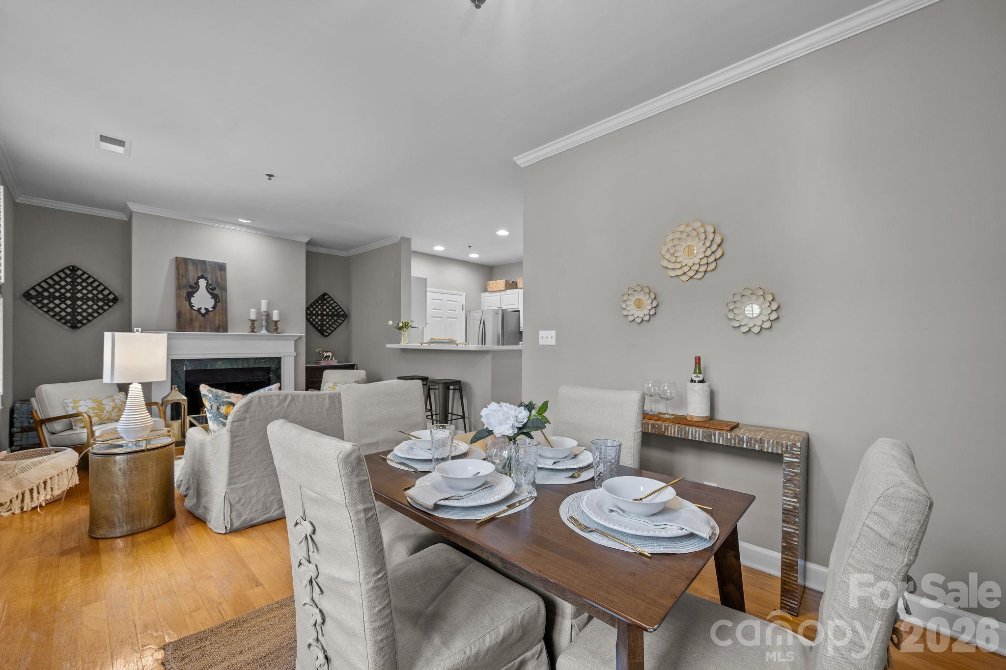 416 Queens Road, Unit 19 Charlotte, NC 28207 - Photo 4 of 24 a view of a dining room with furniture and a table