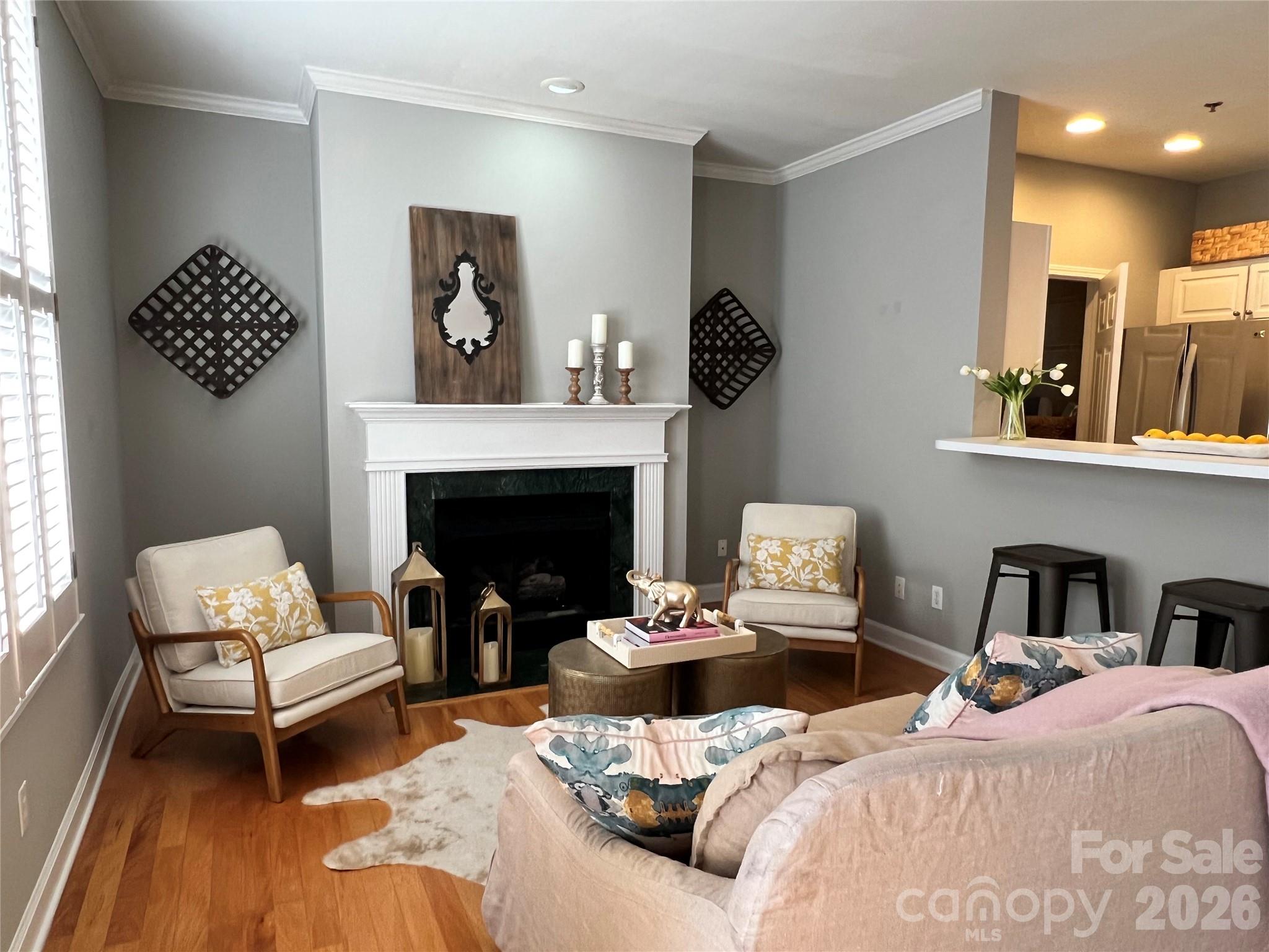 416 Queens Road, Unit 19 Charlotte, NC 28207 - Photo 7 of 24 a bedroom with furniture and a fireplace