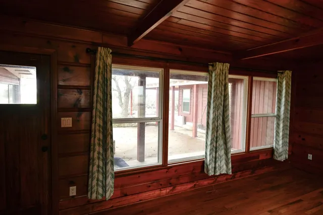 a view of gallery with wooden floor