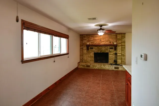 a kitchen with granite countertop wooden cabinets and stainless steel appliances