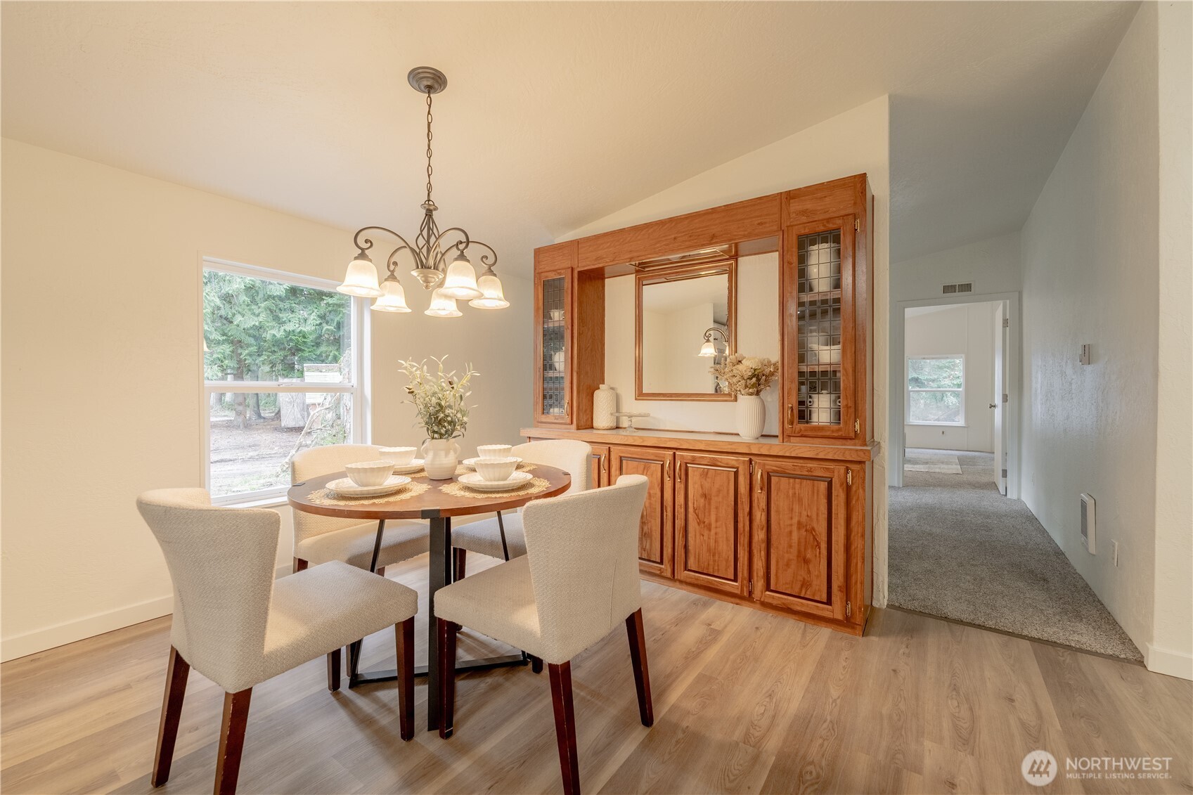 10794 Halloran Road Bow, WA 98232 - Photo 15 of 39 a view of a dining room with furniture window and wooden floor
