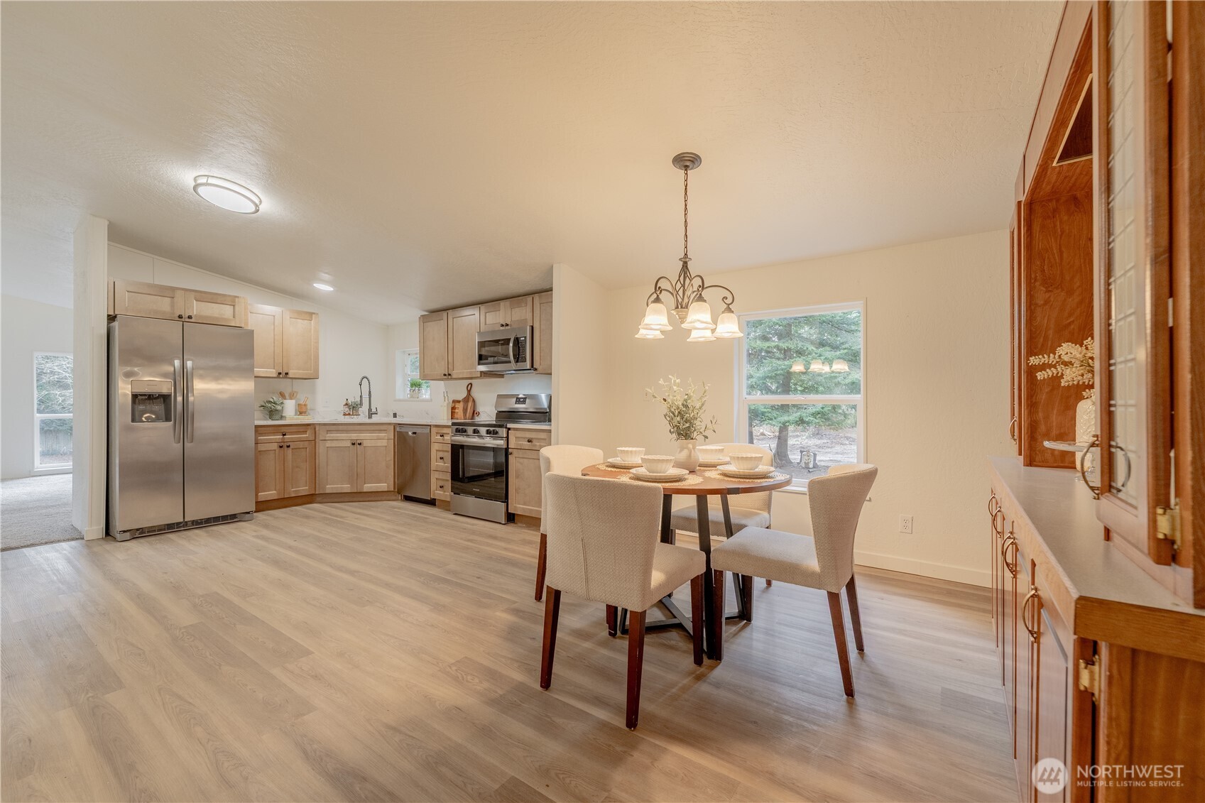 10794 Halloran Road Bow, WA 98232 - Photo 17 of 39 a view of kitchen with furniture and wooden floor