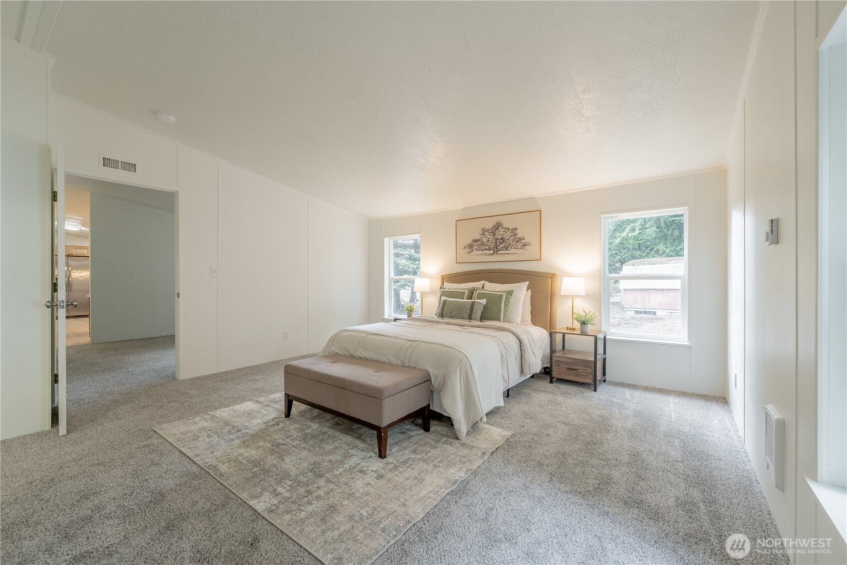 10794 Halloran Road Bow, WA 98232 - Photo 20 of 39 a spacious bedroom with a bed and a window