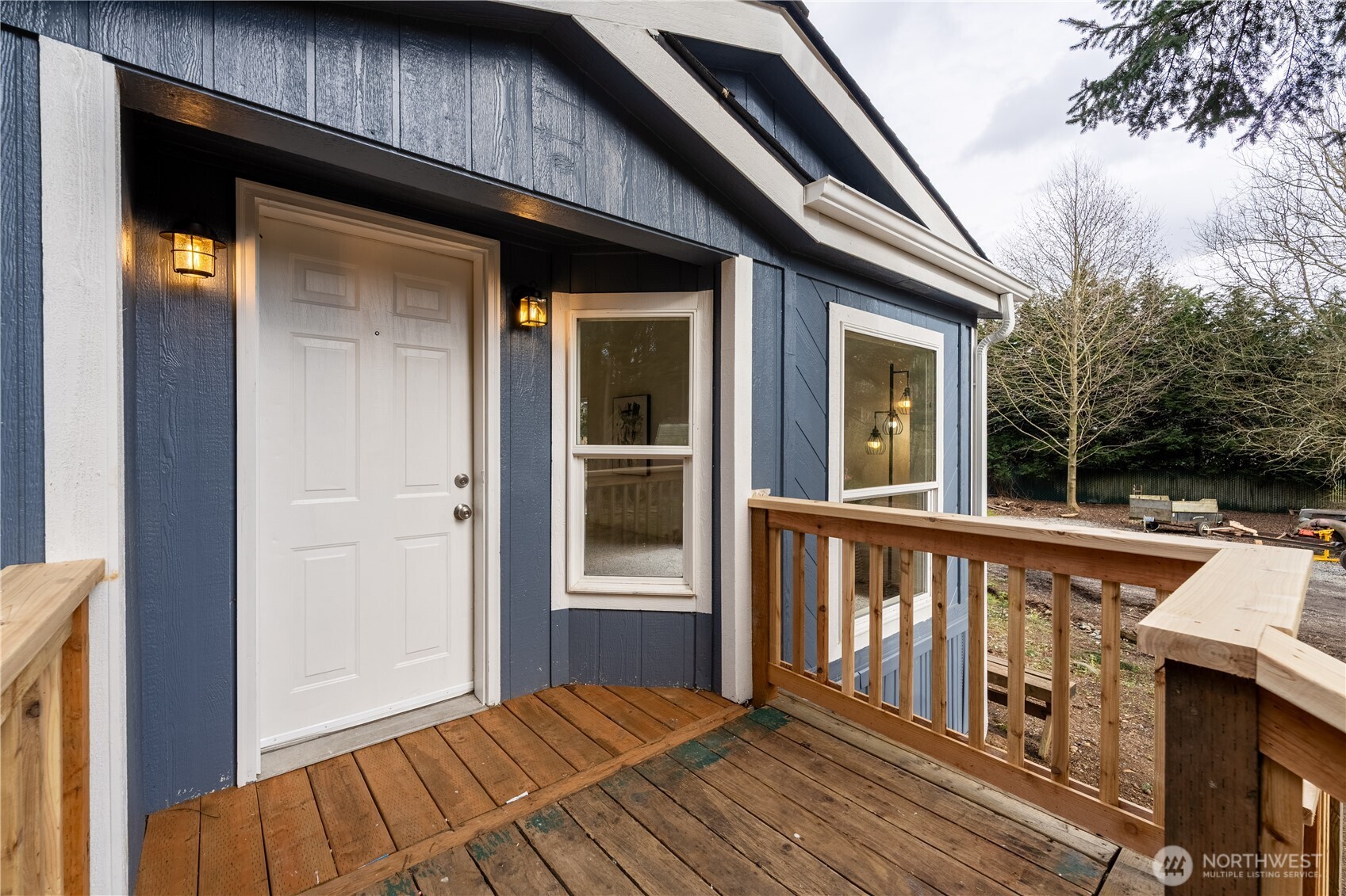 10794 Halloran Road Bow, WA 98232 - Photo 2 of 39 a view of a house with wooden deck