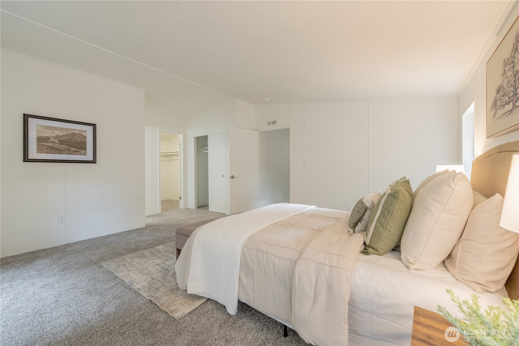 10794 Halloran Road Bow, WA 98232 - Photo 21 of 39 a bedroom with a bed and a painting on the wall