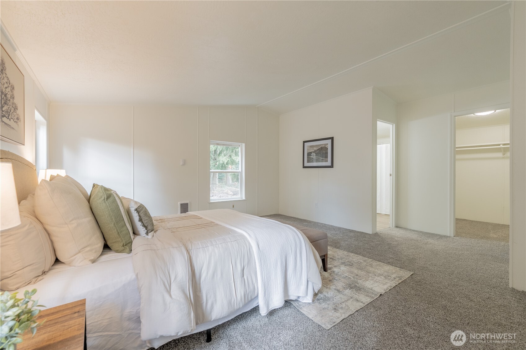 10794 Halloran Road Bow, WA 98232 - Photo 22 of 39 a bedroom with a bed and a window