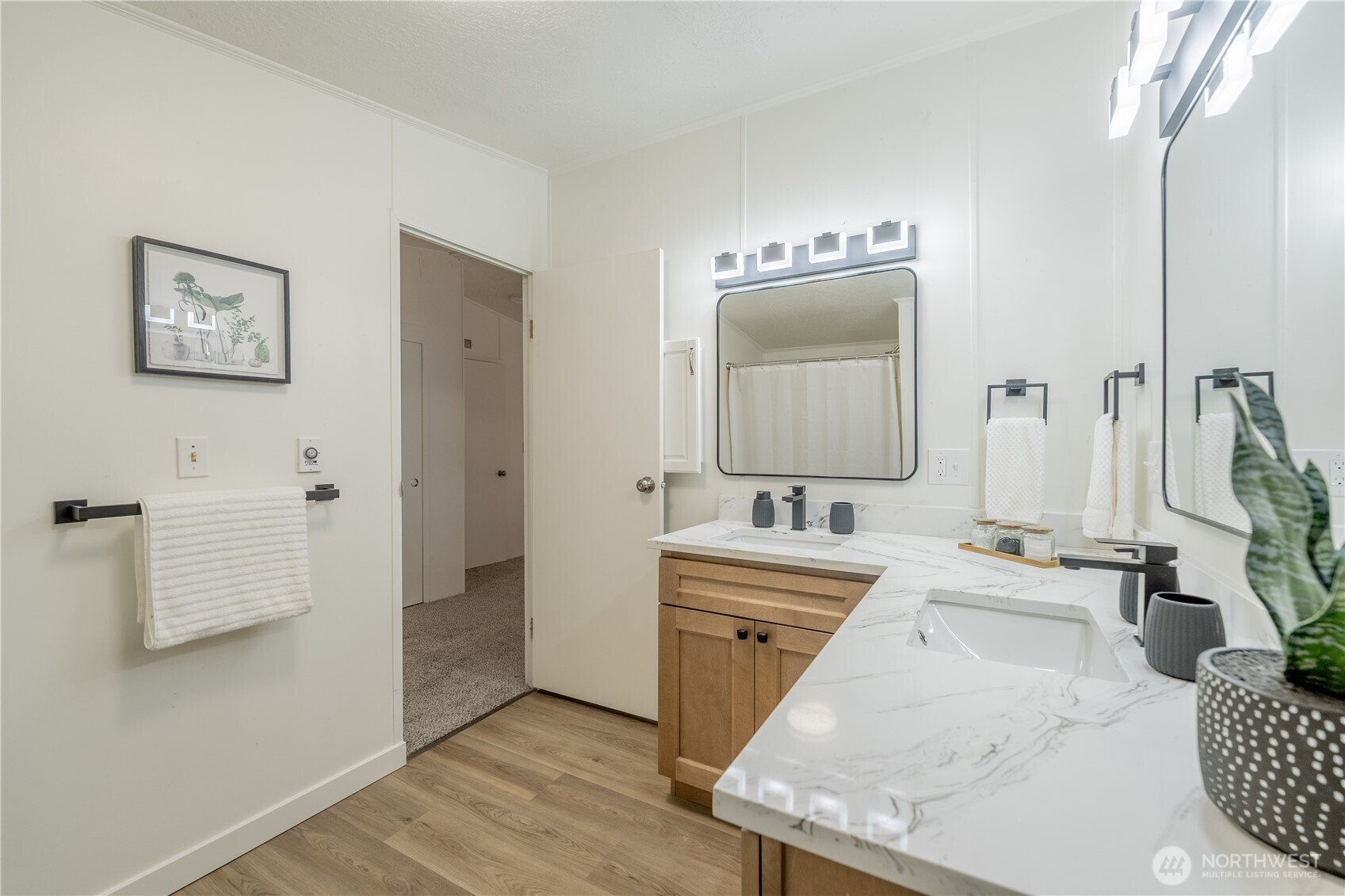 10794 Halloran Road Bow, WA 98232 - Photo 26 of 39 a en suite bathroom with a double vanity sink and mirror
