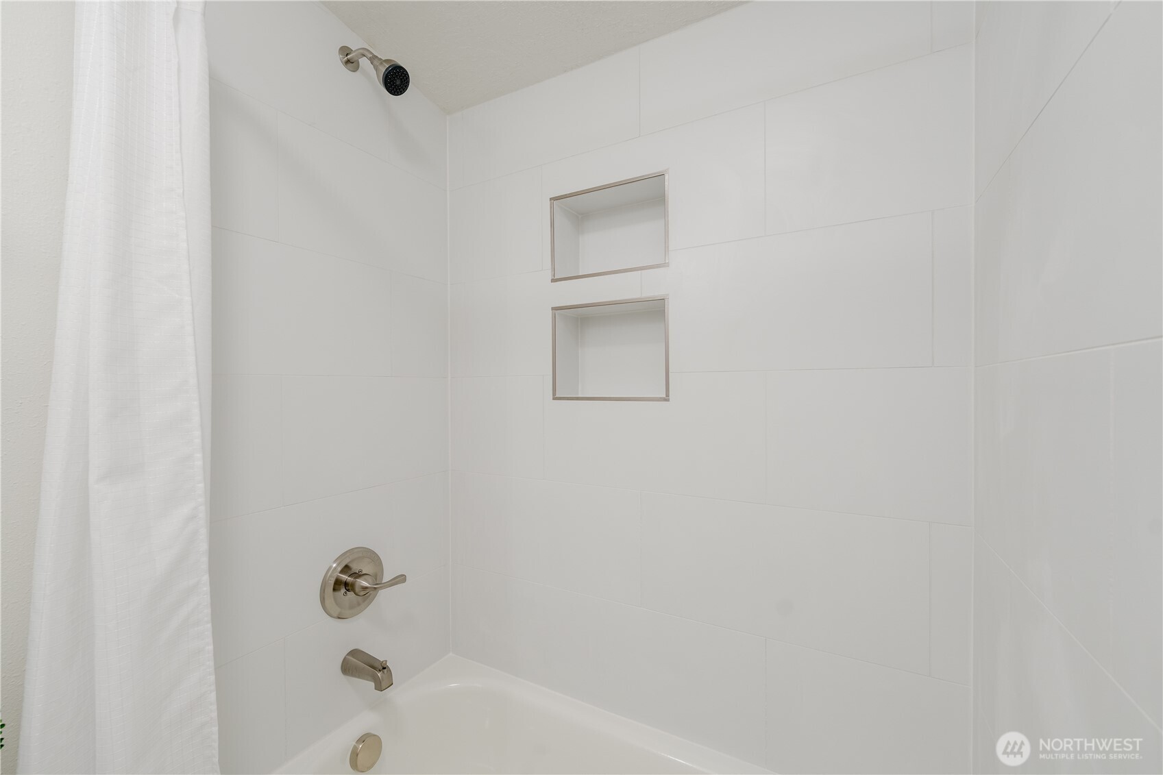 10794 Halloran Road Bow, WA 98232 - Photo 32 of 39 a bathroom with a bathtub