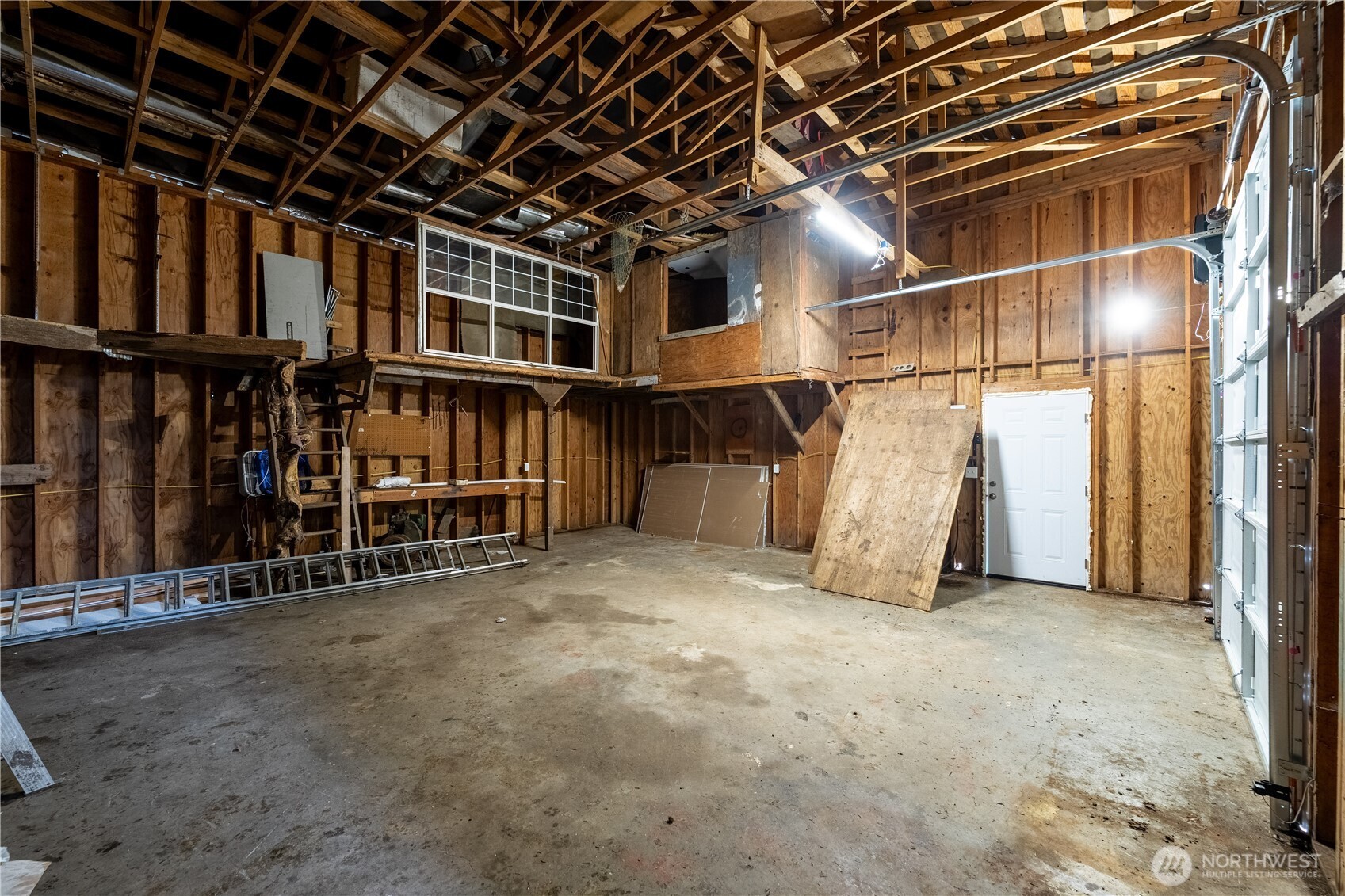 10794 Halloran Road Bow, WA 98232 - Photo 36 of 39 a view of an empty room with wooden walls