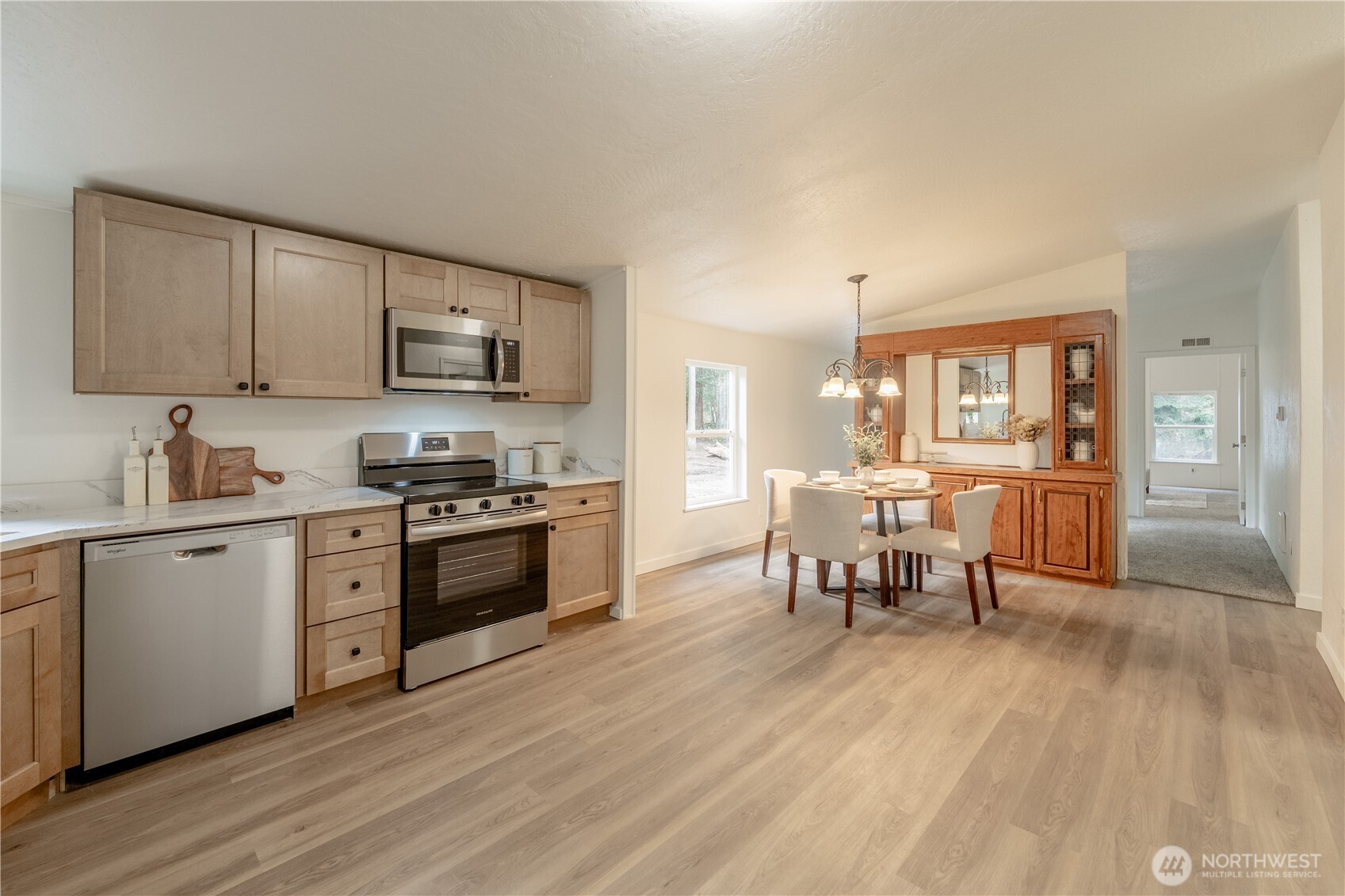 10794 Halloran Road Bow, WA 98232 - Photo 10 of 39 a kitchen with a sink cabinets and wooden floor