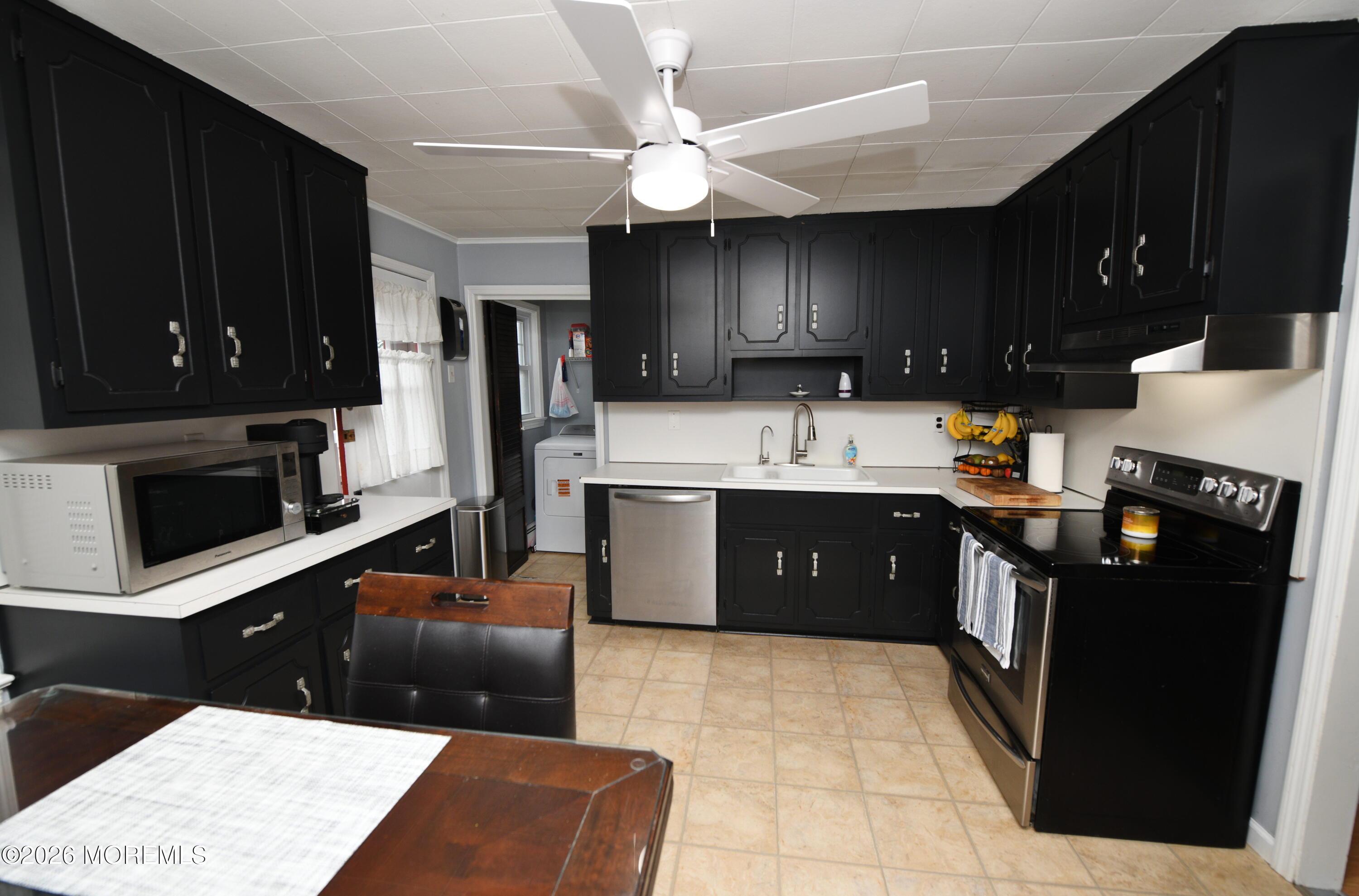 232 Pearce Avenue Point Pleasant, NJ 08742 - Photo 10 of 27 a kitchen with stainless steel appliances granite countertop a stove a refrigerator a sink and dishwasher