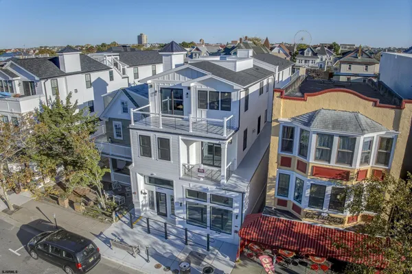 an aerial view of a residential apartment building with a yard