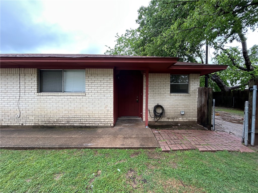 1913 Pine Tree Drive, Unit B Bryan, TX 77802 - Photo 2 of 13 a backyard of a house with seating space