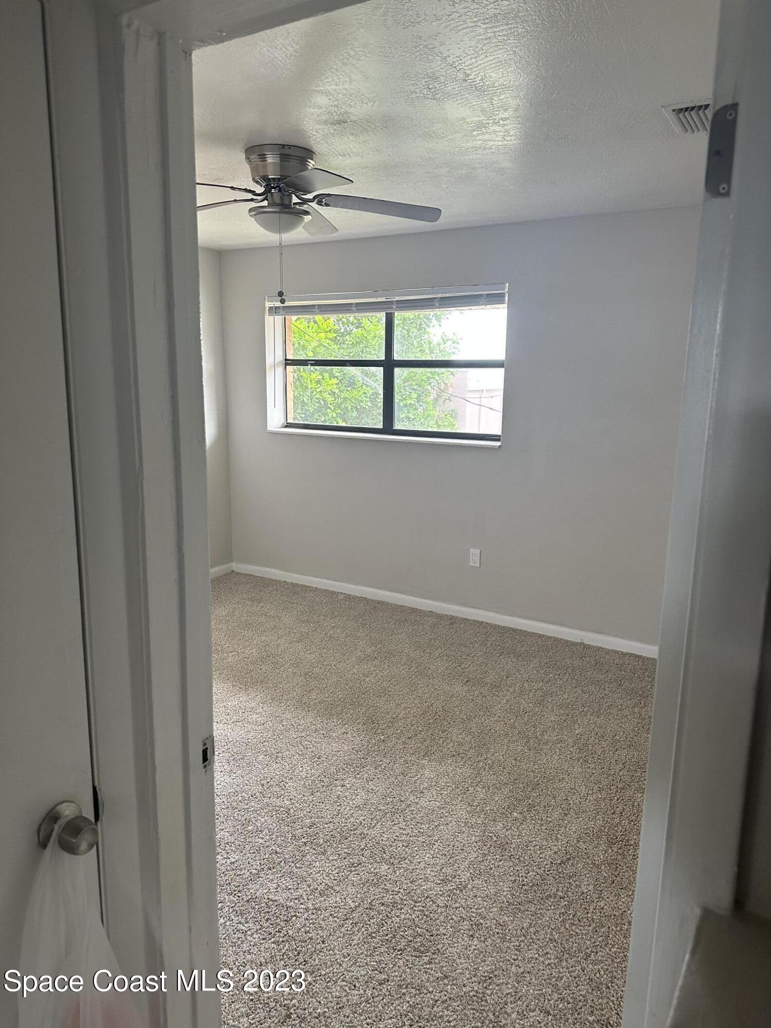 23 Elton Street, Unit 23 Melbourne, FL 32935 - Photo 3 of 4 a view of a window in a room