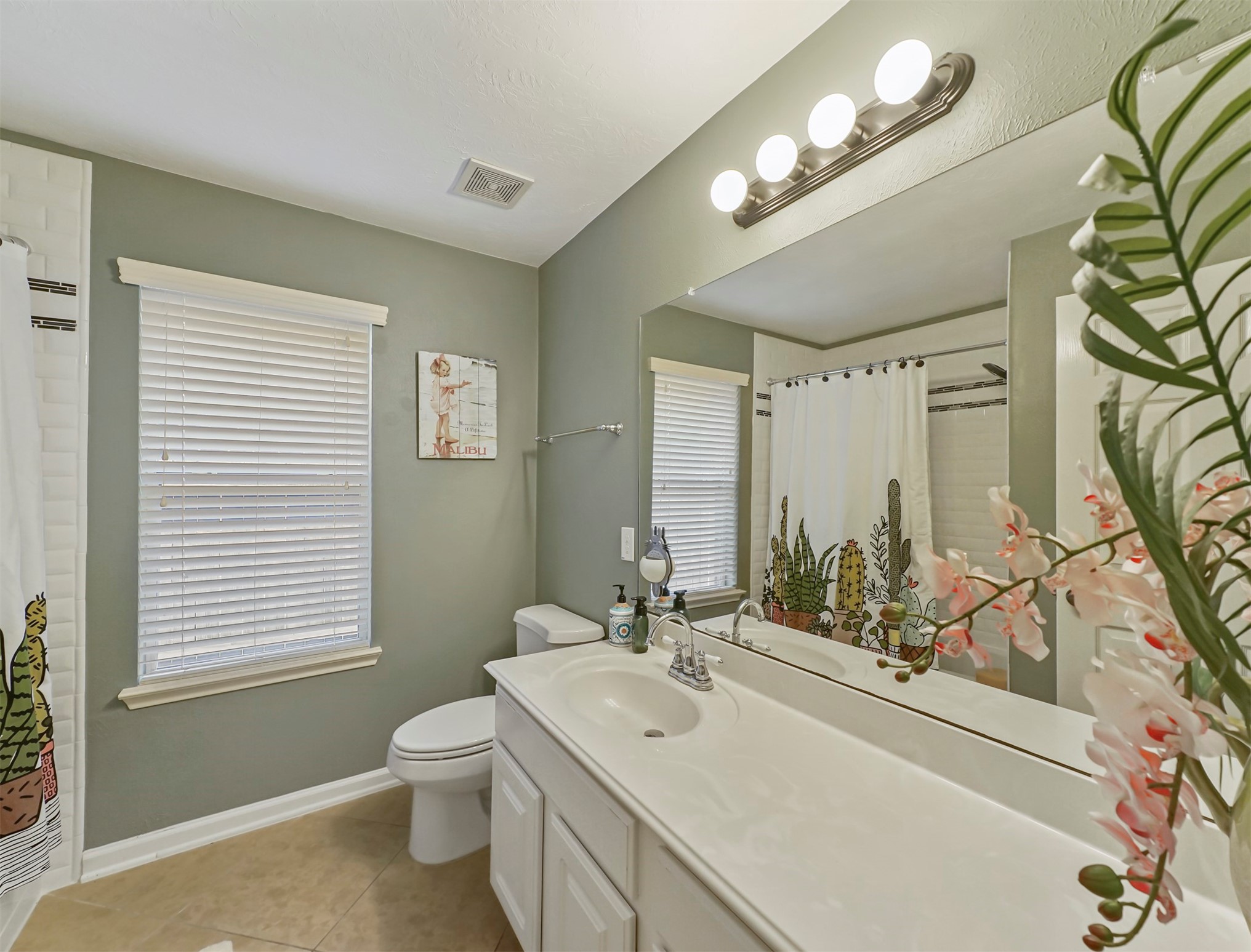 8214 Garrison Point Drive Houston, TX 77040 - Photo 14 of 37 a bathroom with a sink a toilet and a mirror