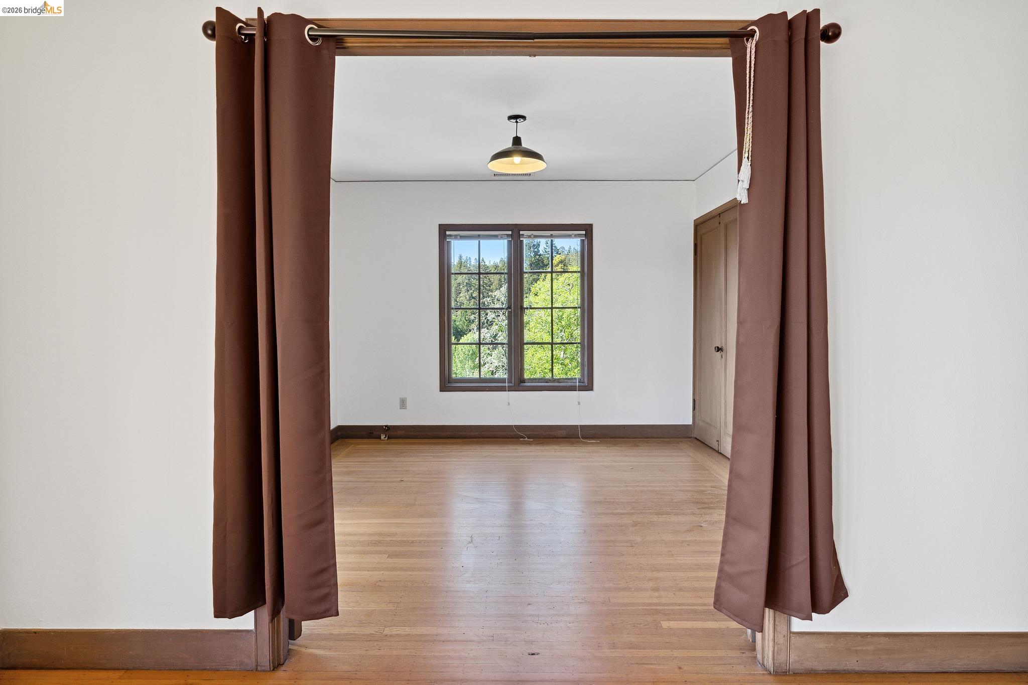 2501 Rose Walk Berkeley, CA 94708 - Photo 53 of 60 a view of a hallway with wooden floor and a window