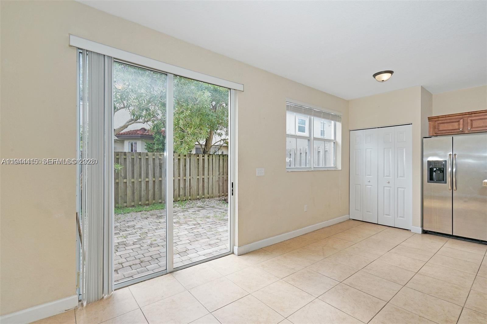1048 Northeast 208th Street Miami, FL 33179 - Photo 11 of 36 a view of entryway with window