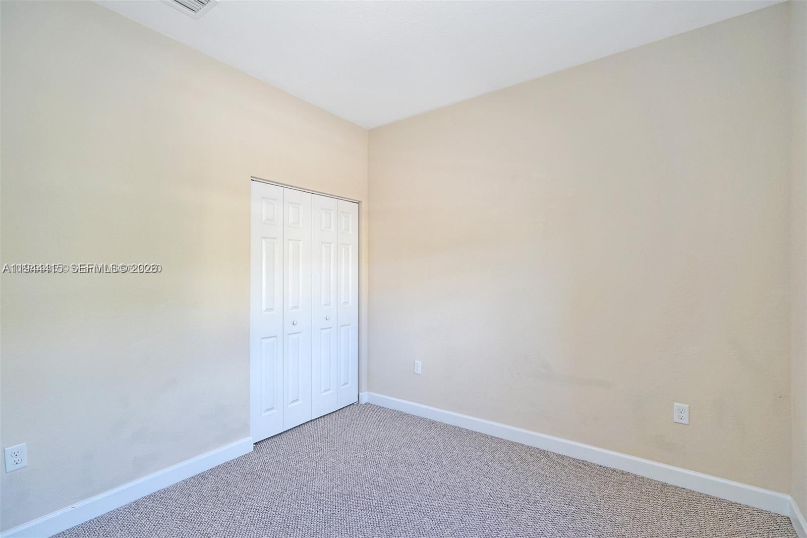 1048 Northeast 208th Street Miami, FL 33179 - Photo 28 of 36 a view of an empty room
