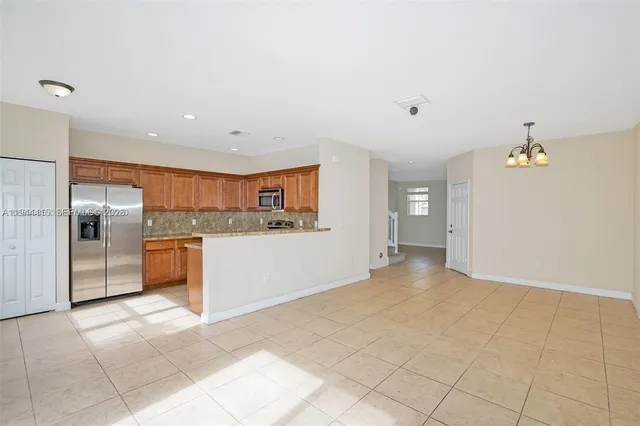 a view of a kitchen with a sink and an oven