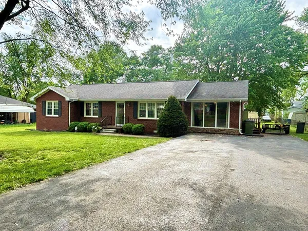 a view of a house with a yard