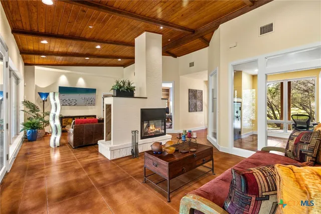 a bedroom with furniture and a fireplace