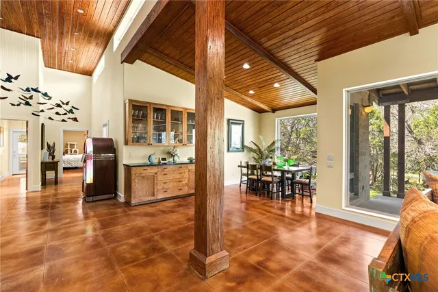 a view of a dining room with furniture window and outside view