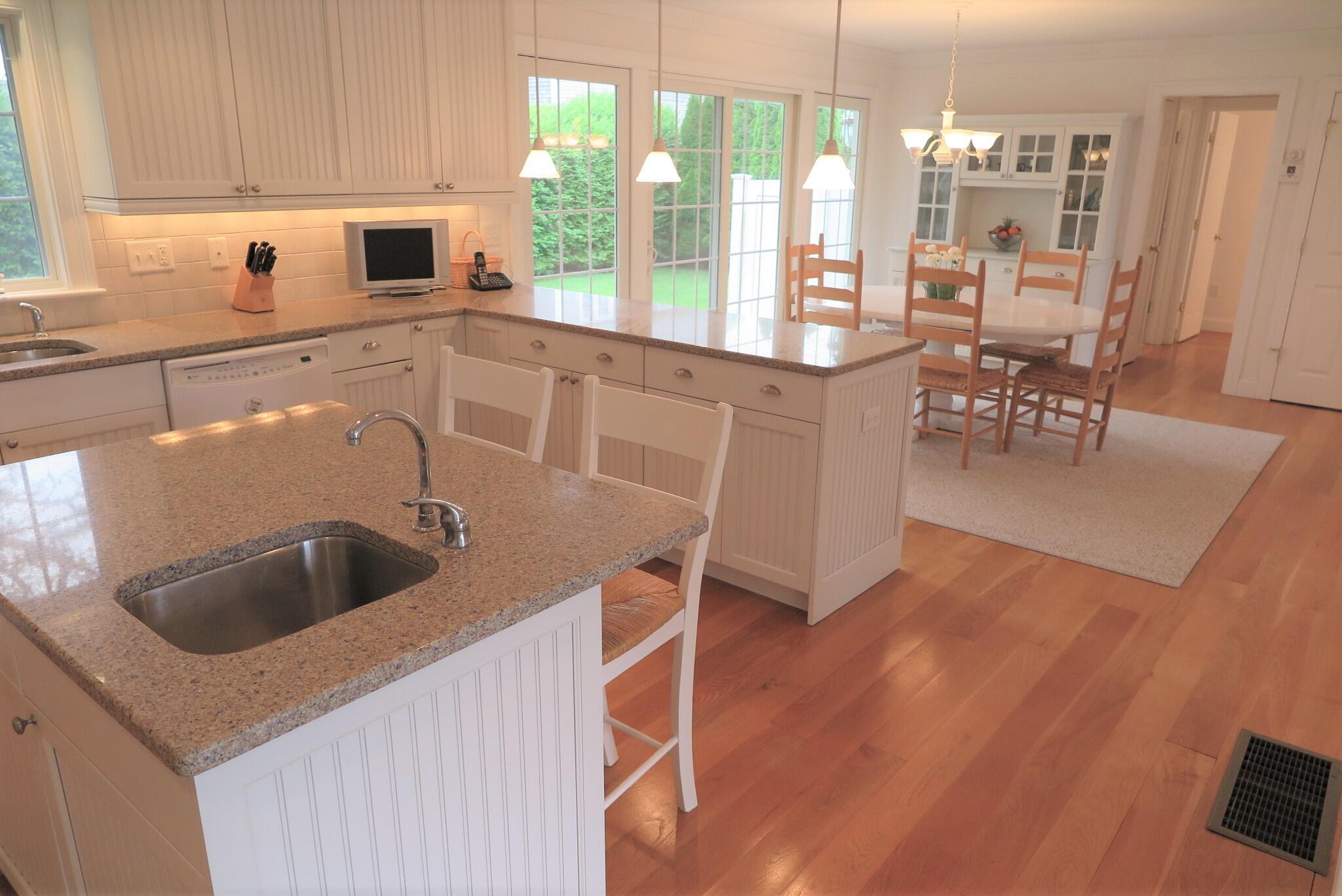 79 Shore Road West Dennis, MA 02670 - Photo 13 of 42 a kitchen with a sink and cabinets