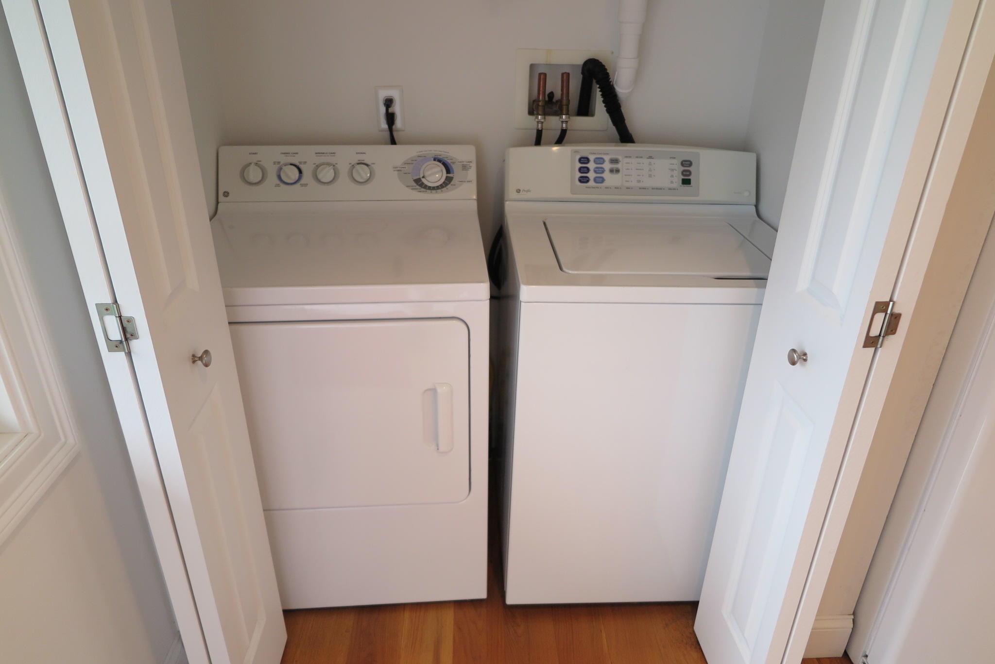 79 Shore Road West Dennis, MA 02670 - Photo 16 of 42 a utility room with dryer and washer