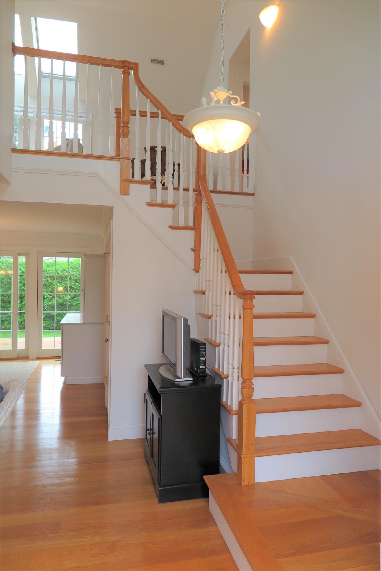 79 Shore Road West Dennis, MA 02670 - Photo 17 of 42 a view of entryway and hall with wooden floor