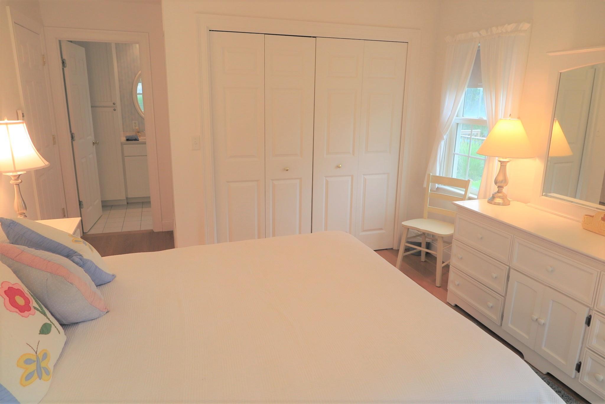 79 Shore Road West Dennis, MA 02670 - Photo 25 of 42 a bedroom with a bed and a window