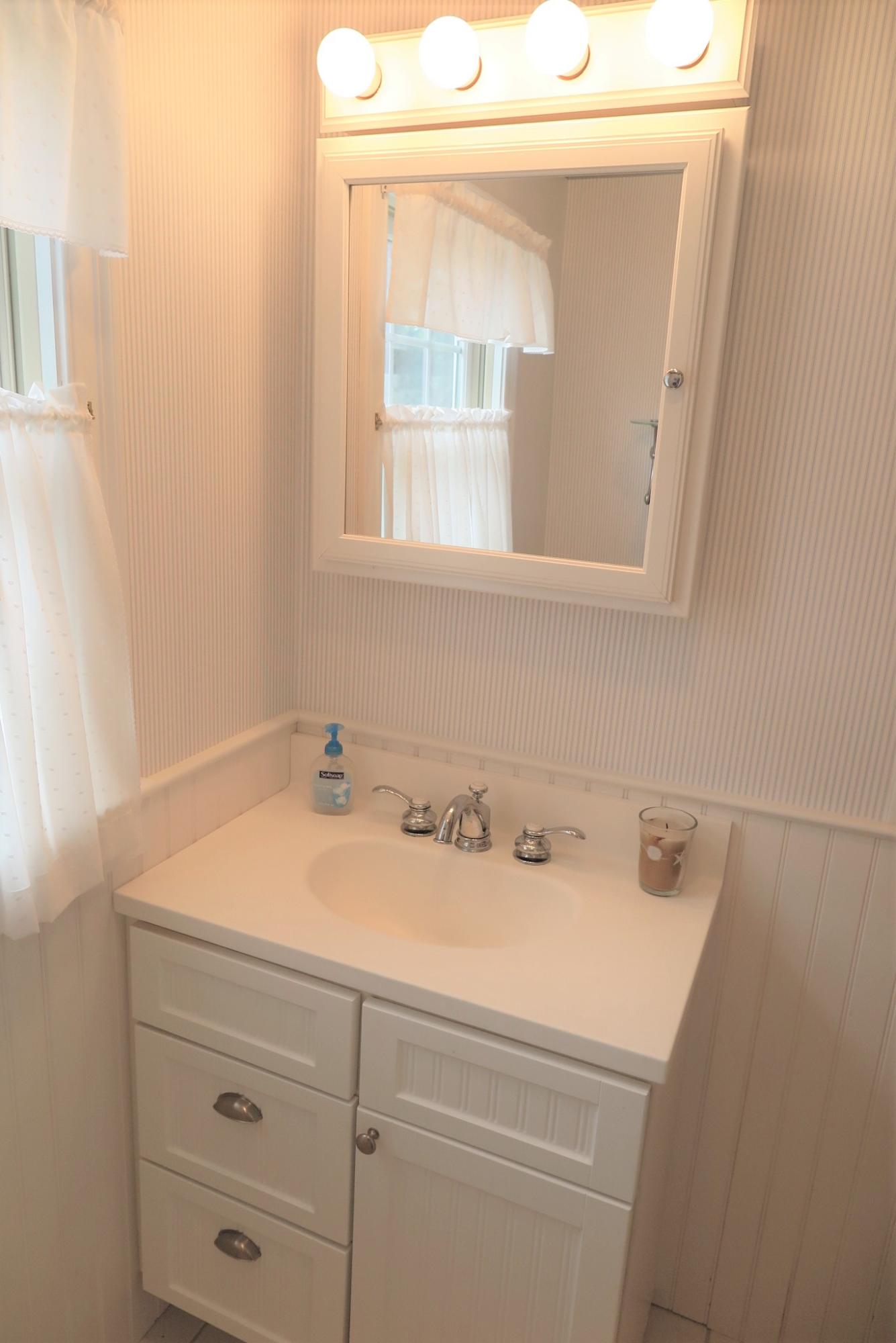 79 Shore Road West Dennis, MA 02670 - Photo 27 of 42 a bathroom with a sink and a vanity