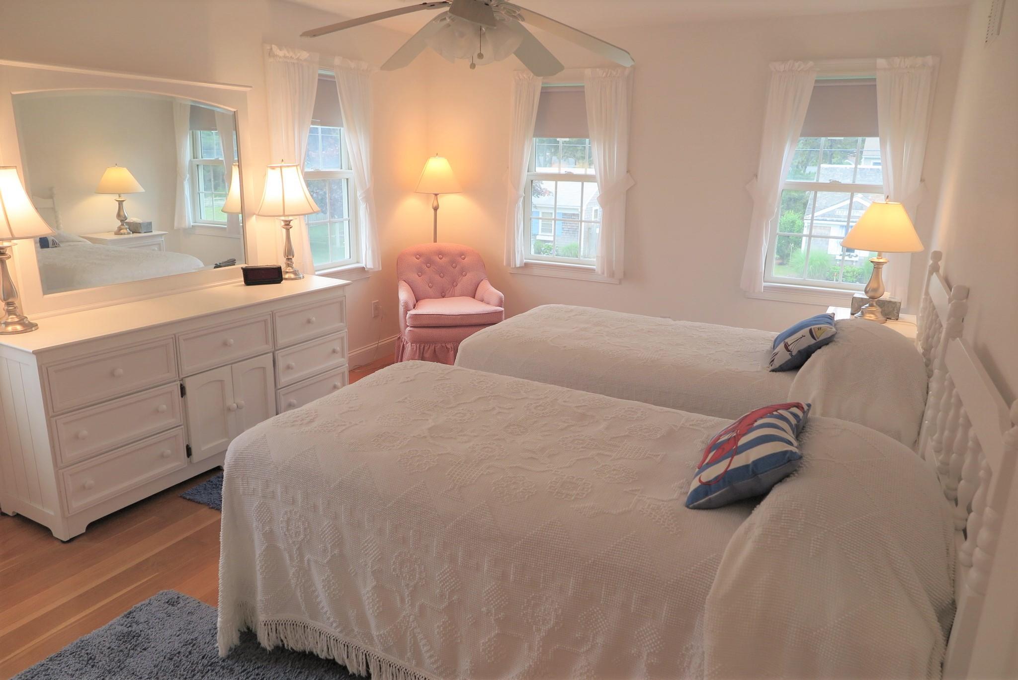 79 Shore Road West Dennis, MA 02670 - Photo 28 of 42 a bedroom with a bed and a large mirror on the dresser