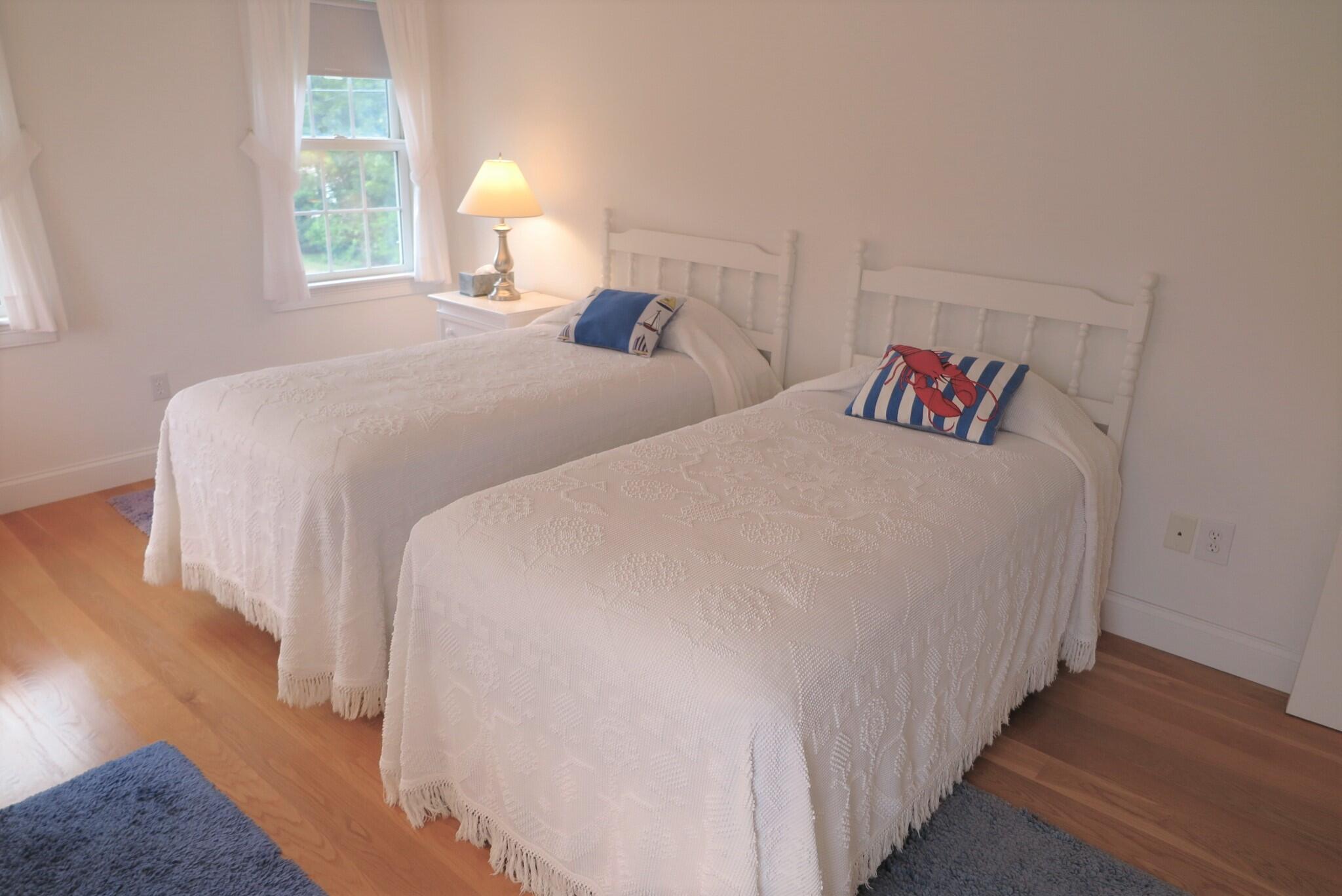 79 Shore Road West Dennis, MA 02670 - Photo 29 of 42 a bedroom with bed and a window