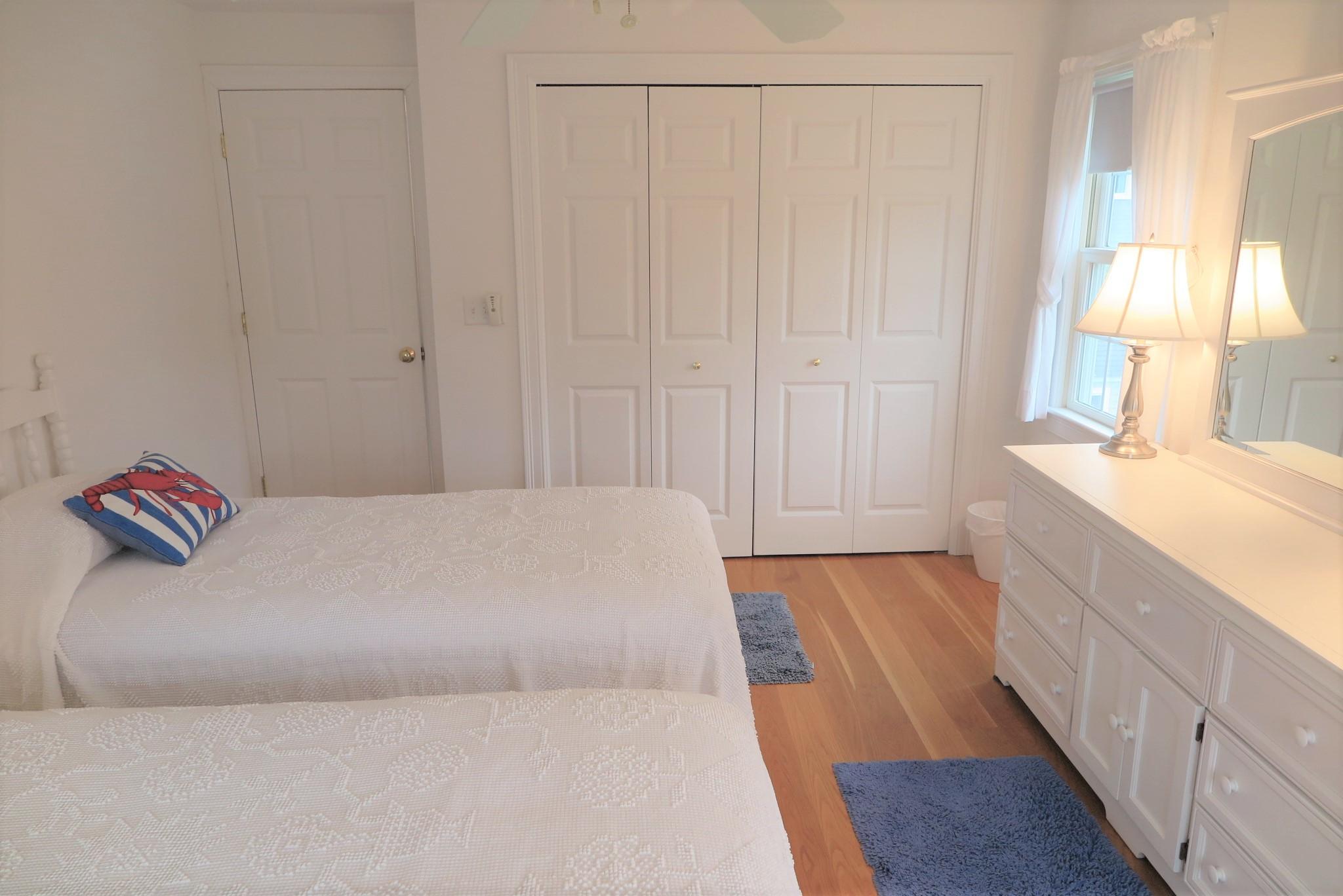 79 Shore Road West Dennis, MA 02670 - Photo 30 of 42 a living room with a couch and a dresser