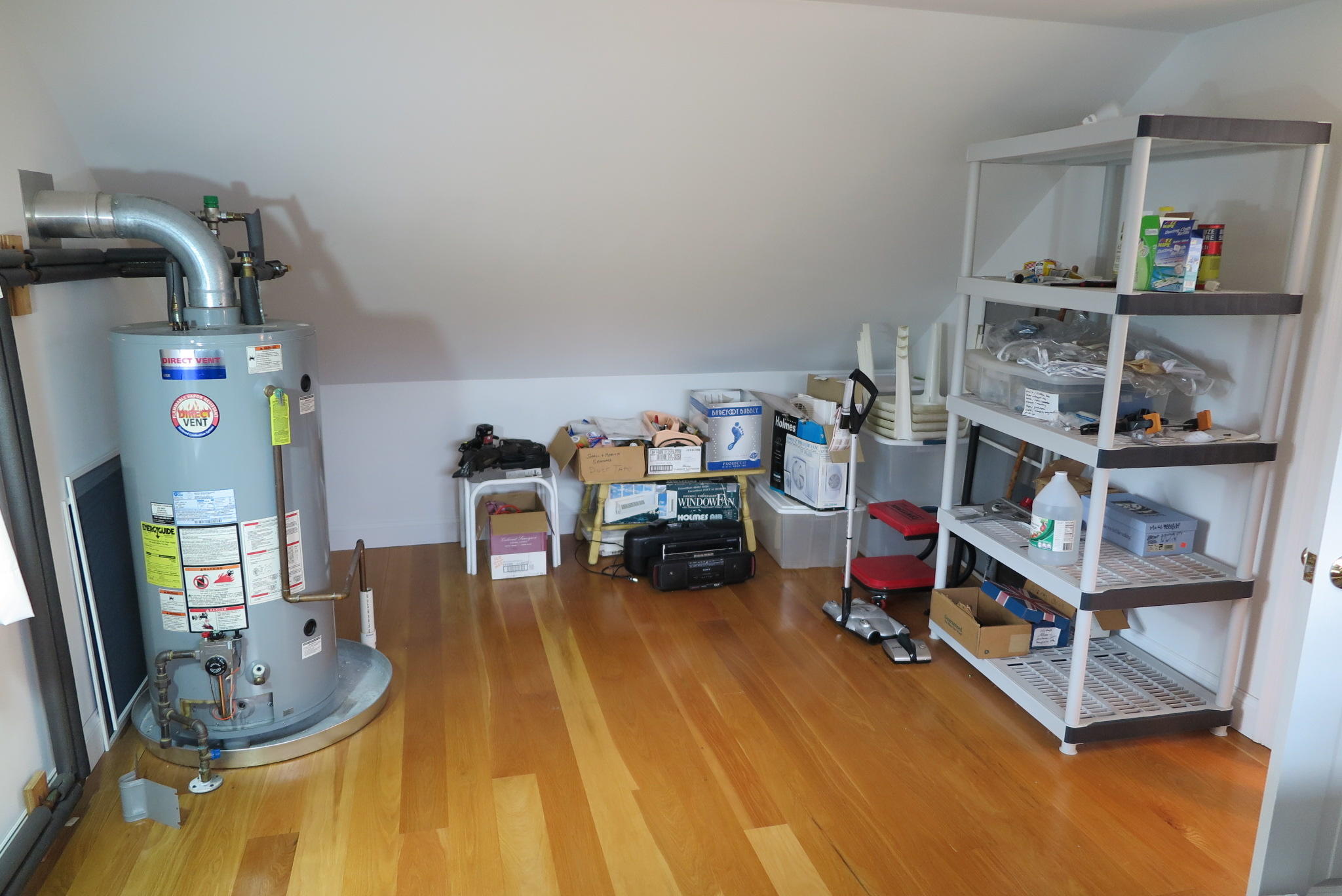 79 Shore Road West Dennis, MA 02670 - Photo 38 of 42 a room with furniture and a wooden floor