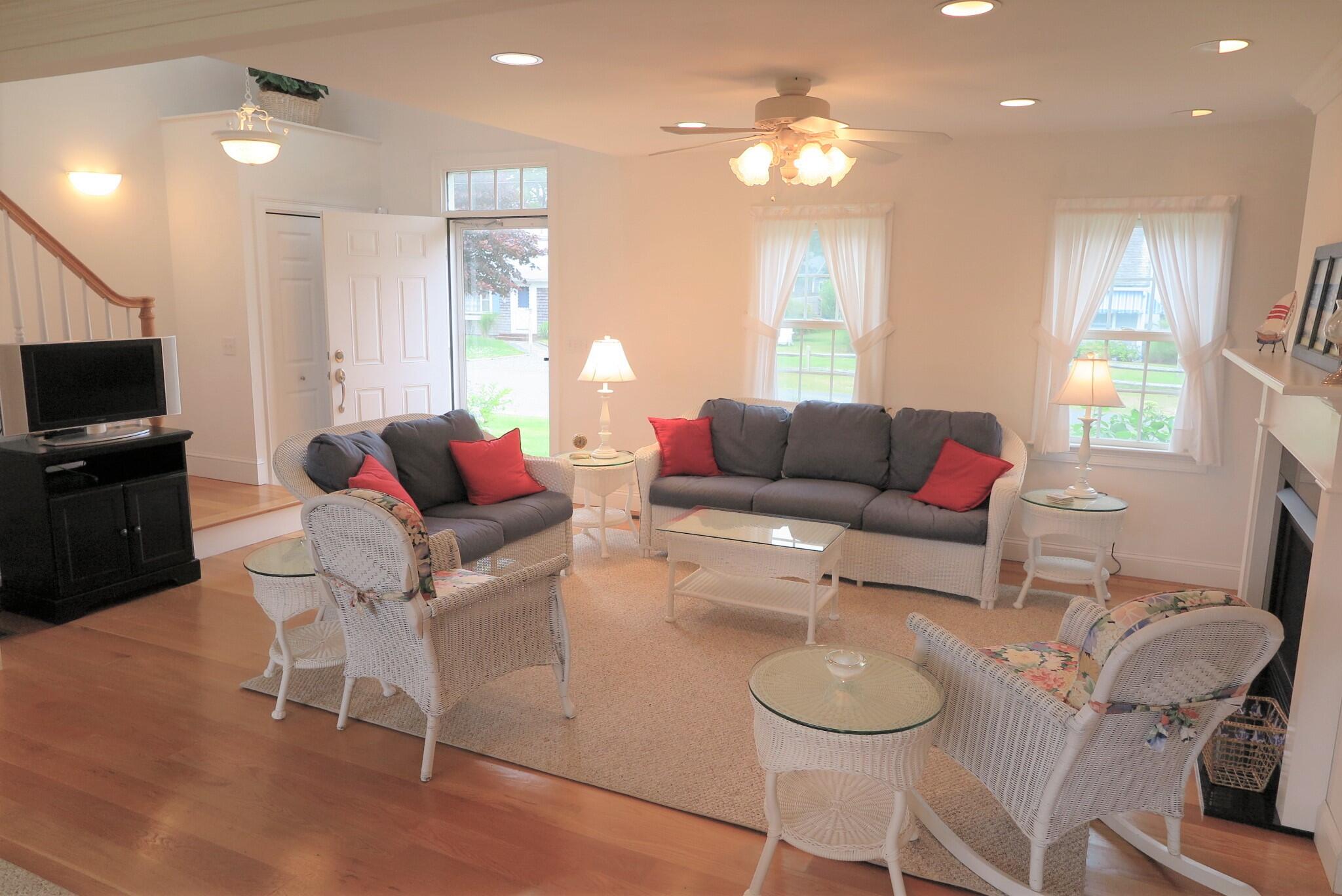 79 Shore Road West Dennis, MA 02670 - Photo 8 of 42 a living room with furniture a flat screen tv and window