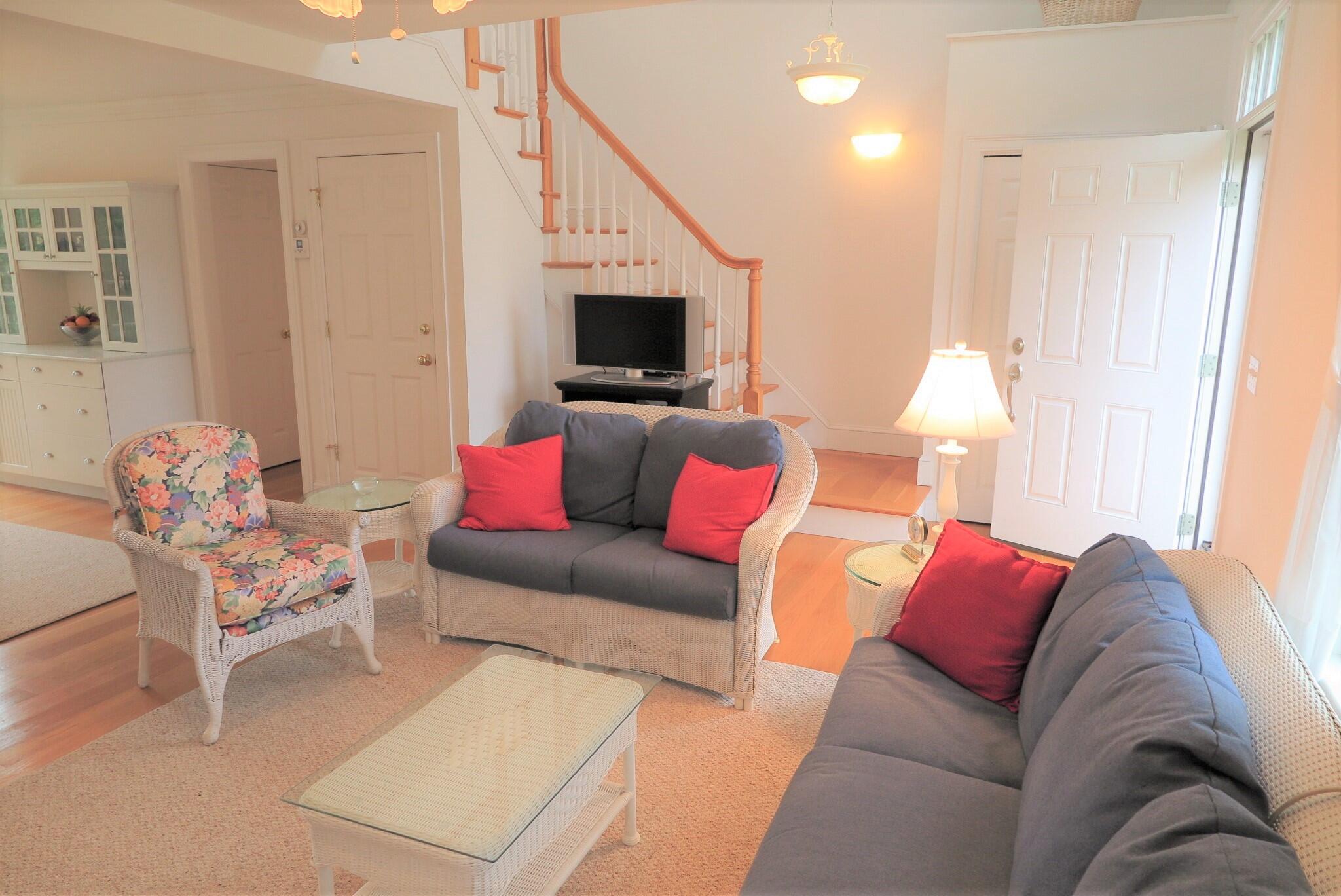 79 Shore Road West Dennis, MA 02670 - Photo 10 of 42 a living room with furniture and a flat screen tv