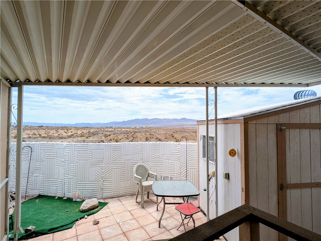 2000 Ramar Road, Unit 280 Bullhead City, AZ 86442 - Photo 8 of 63 a backyard of a house with table and chairs