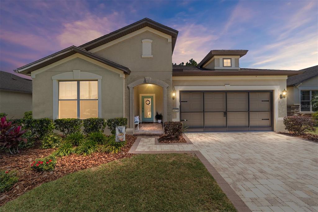 6623 Southwest 97th Terrace Road Ocala, FL 34481 - Photo 1 of 1 a front view of a house with garden